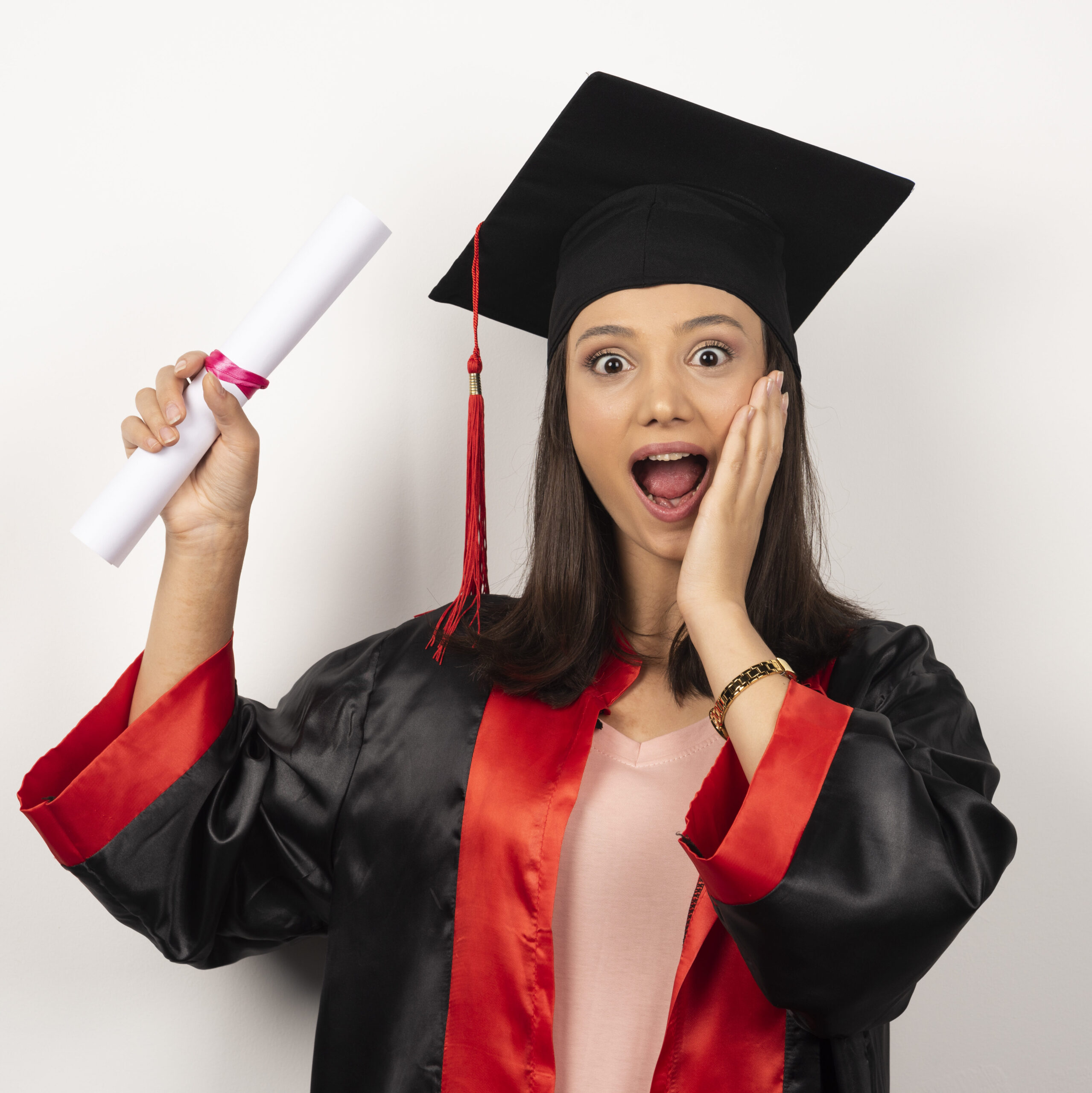 college graduate female in gown feeling happy on white background